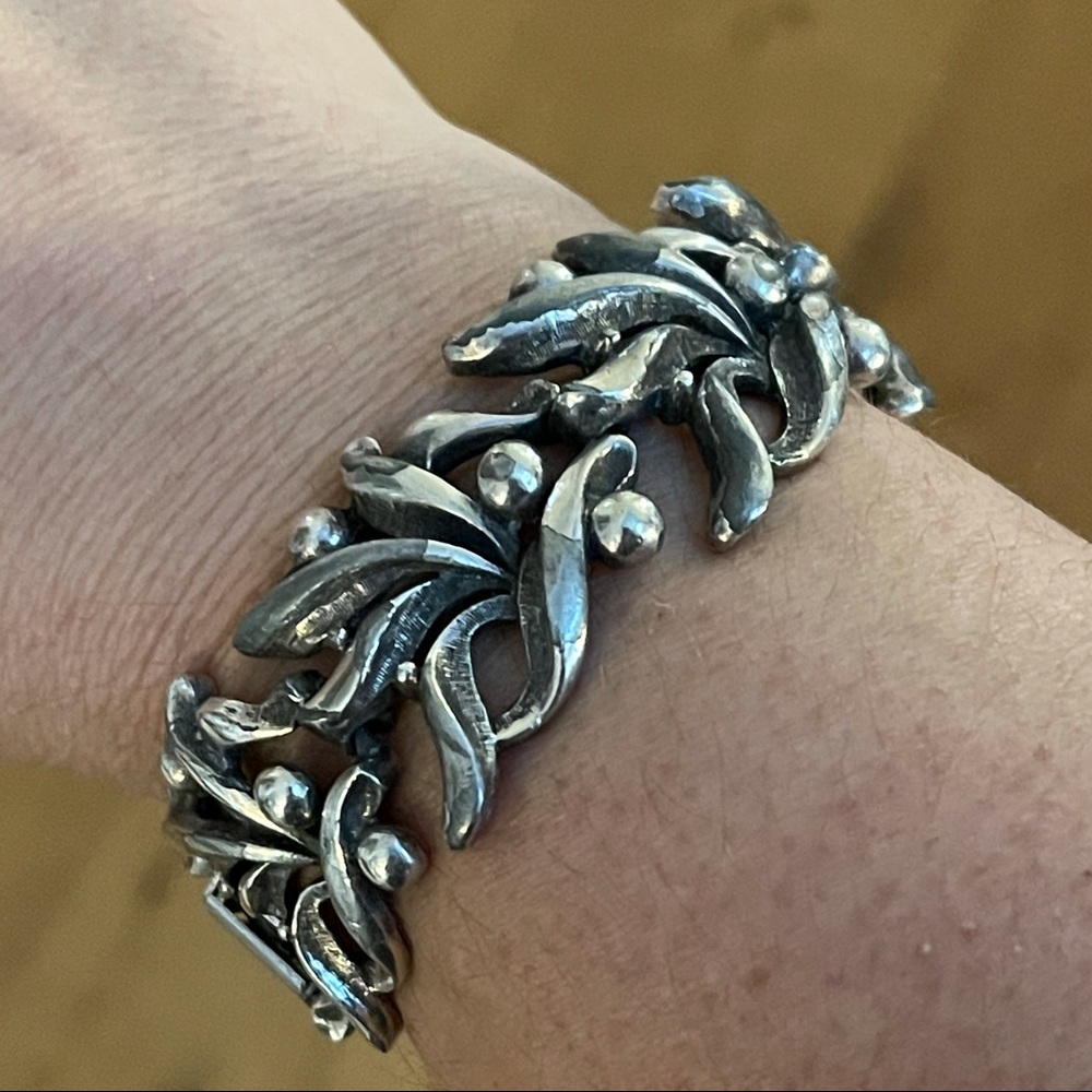 Signed Tortolani silver tone bracelet bangle